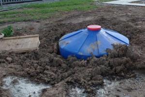 Water supply system for a private house with a storage tank